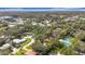 Aerial view of property showing home, pool, and tennis court at 2358 Havana Dr, Clearwater, FL 33764