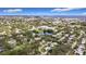 Breathtaking aerial shot of a verdant neighborhood with glimpses of the waterfront at 2358 Havana Dr, Clearwater, FL 33764