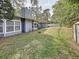 House backyard view with covered patio and fenced yard at 2358 Havana Dr, Clearwater, FL 33764
