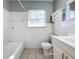 Clean bathroom with a tub, toilet and vanity at 2358 Havana Dr, Clearwater, FL 33764