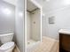 Simple bathroom with toilet and a tiled shower stall at 2358 Havana Dr, Clearwater, FL 33764