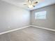 Bright bedroom with ceiling fan and wood-look flooring at 2358 Havana Dr, Clearwater, FL 33764