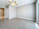 Bedroom with gray walls, wood-look floors, and ceiling fan at 2358 Havana Dr, Clearwater, FL 33764