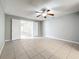 Bedroom with tile floors, ceiling fan and access to other rooms at 2358 Havana Dr, Clearwater, FL 33764