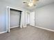 Bedroom with ceiling fan and an adjacent hallway at 2358 Havana Dr, Clearwater, FL 33764