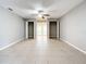 Bright bedroom featuring tile floors, a ceiling fan and access to backyard at 2358 Havana Dr, Clearwater, FL 33764