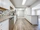 Open concept kitchen with an island and granite countertops at 2358 Havana Dr, Clearwater, FL 33764