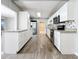 Modern kitchen with white cabinets and stainless steel appliances at 2358 Havana Dr, Clearwater, FL 33764