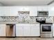 Updated kitchen with stainless steel appliances and granite countertops at 2358 Havana Dr, Clearwater, FL 33764