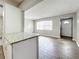 Kitchen with granite countertops, white cabinets, and tile floors at 2358 Havana Dr, Clearwater, FL 33764