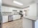 Modern kitchen with granite countertops and white cabinets at 2358 Havana Dr, Clearwater, FL 33764