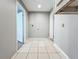 Functional laundry area with tile flooring and access to other rooms at 2358 Havana Dr, Clearwater, FL 33764