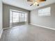 Living room with gray walls, vinyl flooring, bay window, and ceiling fan at 2358 Havana Dr, Clearwater, FL 33764