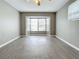 Spacious living room with gray walls, vinyl flooring, and a bay window at 2358 Havana Dr, Clearwater, FL 33764