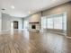 Open living room showcasing tile floors and a cozy fireplace at 2358 Havana Dr, Clearwater, FL 33764