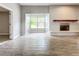 Bright living room with tile floors, fireplace, and large windows at 2358 Havana Dr, Clearwater, FL 33764