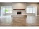 Spacious living area featuring a fireplace and abundant natural light at 2358 Havana Dr, Clearwater, FL 33764