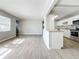 Spacious living room with wood-look tile flooring and a fireplace at 2358 Havana Dr, Clearwater, FL 33764