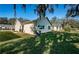 View of house exterior showcasing a manicured lawn at 4993 Bostonian Loop # 4993, New Port Richey, FL 34655