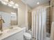Bright bathroom with modern sink, toilet and shower/tub combo at 8916 Arabella Ln, Seminole, FL 33777
