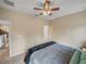 Inviting bedroom with ceiling fan, and neutral decor for a relaxing atmosphere at 8916 Arabella Ln, Seminole, FL 33777
