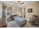 Cozy bedroom with natural light, a comfortable bed, and a unique decorative touch at 8916 Arabella Ln, Seminole, FL 33777