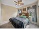 Cozy bedroom with a comfortable bed and natural light from the windows at 8916 Arabella Ln, Seminole, FL 33777