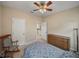 Bright bedroom featuring neutral walls, ceiling fan and traditional furniture at 8916 Arabella Ln, Seminole, FL 33777