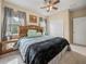 Sunny bedroom with bed, side table, and closet, bathed in natural light at 8916 Arabella Ln, Seminole, FL 33777