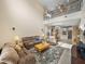 Open-concept living room with high ceilings that flows into the kitchen and dining area at 8916 Arabella Ln, Seminole, FL 33777