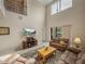 Bright living room featuring high ceilings and a sliding glass door leading to the outdoors at 8916 Arabella Ln, Seminole, FL 33777