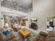 Expansive living space with view to loft area, kitchen, dining, and comfortable seating at 8916 Arabella Ln, Seminole, FL 33777