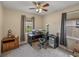 Home office space featuring a ceiling fan and dual windows for ample natural light at 8916 Arabella Ln, Seminole, FL 33777