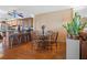 Cozy dining area with hardwood floors, adjacent to the kitchen at 9415 Blind Pass Rd # 905, St Pete Beach, FL 33706