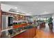 Open concept kitchen with island and stainless steel appliances at 9415 Blind Pass Rd # 905, St Pete Beach, FL 33706