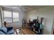 Comfortable living room featuring bright light, desk and couch seating at 9415 Blind Pass Rd # 905, St Pete Beach, FL 33706