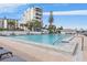 Community pool with ample deck space for lounging at 9415 Blind Pass Rd # 905, St Pete Beach, FL 33706