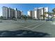 Wide view of the tennis courts in front of the buildings at 9415 Blind Pass Rd # 905, St Pete Beach, FL 33706