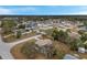 An aerial shot of a residential area with houses, yards, and trees at 11199 Mayflower Rd, Spring Hill, FL 34608