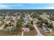 Elevated perspective of homes in a suburban setting, showcasing roofs, yards, and streets at 11199 Mayflower Rd, Spring Hill, FL 34608