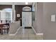 Bright and airy entryway with tiled floors and stained glass at 12028 Timberhill Dr, Riverview, FL 33569