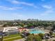 Aerial view of community pool and cityscape in the background at 1220 E 19Th Ave, Tampa, FL 33605