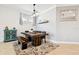 Dining room with farmhouse table and shiplap accent wall at 12926 Payton St, Odessa, FL 33556