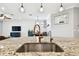 Kitchen island with stainless steel sink and copper faucet at 12926 Payton St, Odessa, FL 33556