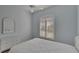 Bedroom with ceiling fan, wood floors, and white dresser at 2217 Platinum Dr, Sun City Center, FL 33573