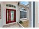 Front entry with a decorative door and sidelights at 2217 Platinum Dr, Sun City Center, FL 33573