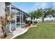 Landscaped poolside area with lush tropical plants at 2217 Platinum Dr, Sun City Center, FL 33573