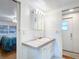 Bathroom with vanity, sink, and view of bedroom at 2331 Belleair Rd # 116, Clearwater, FL 33764