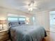 Bedroom with ceiling fan, built in dresser, and ensuite bathroom at 2331 Belleair Rd # 116, Clearwater, FL 33764
