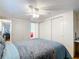 Main bedroom with a ceiling fan, large closet, and a plush bed at 2331 Belleair Rd # 116, Clearwater, FL 33764